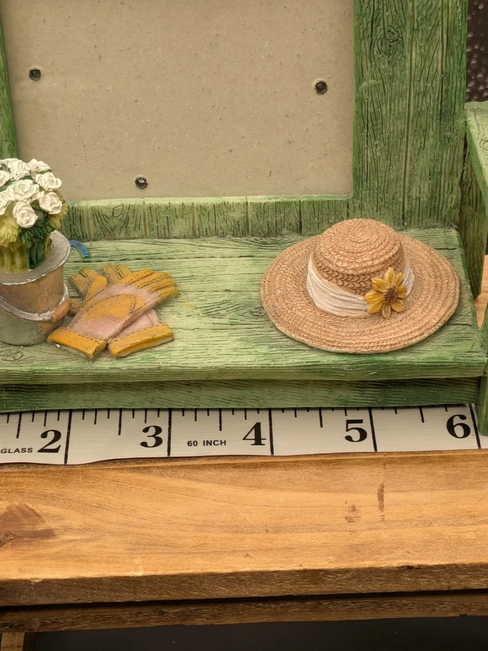 Green Wooden Bench Picture Frame with Hat and Potted Flowers